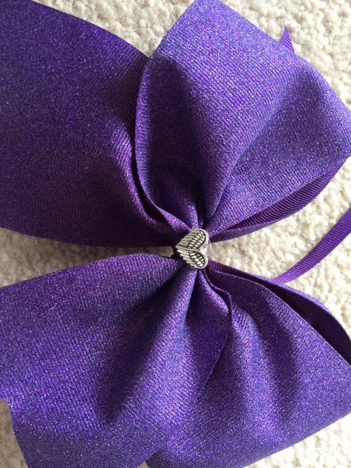 Purple hair ribbons Colleen handcrafted in Marisa's honor for Snapple Bowl cheerleaders. Notice the angel's wings!
